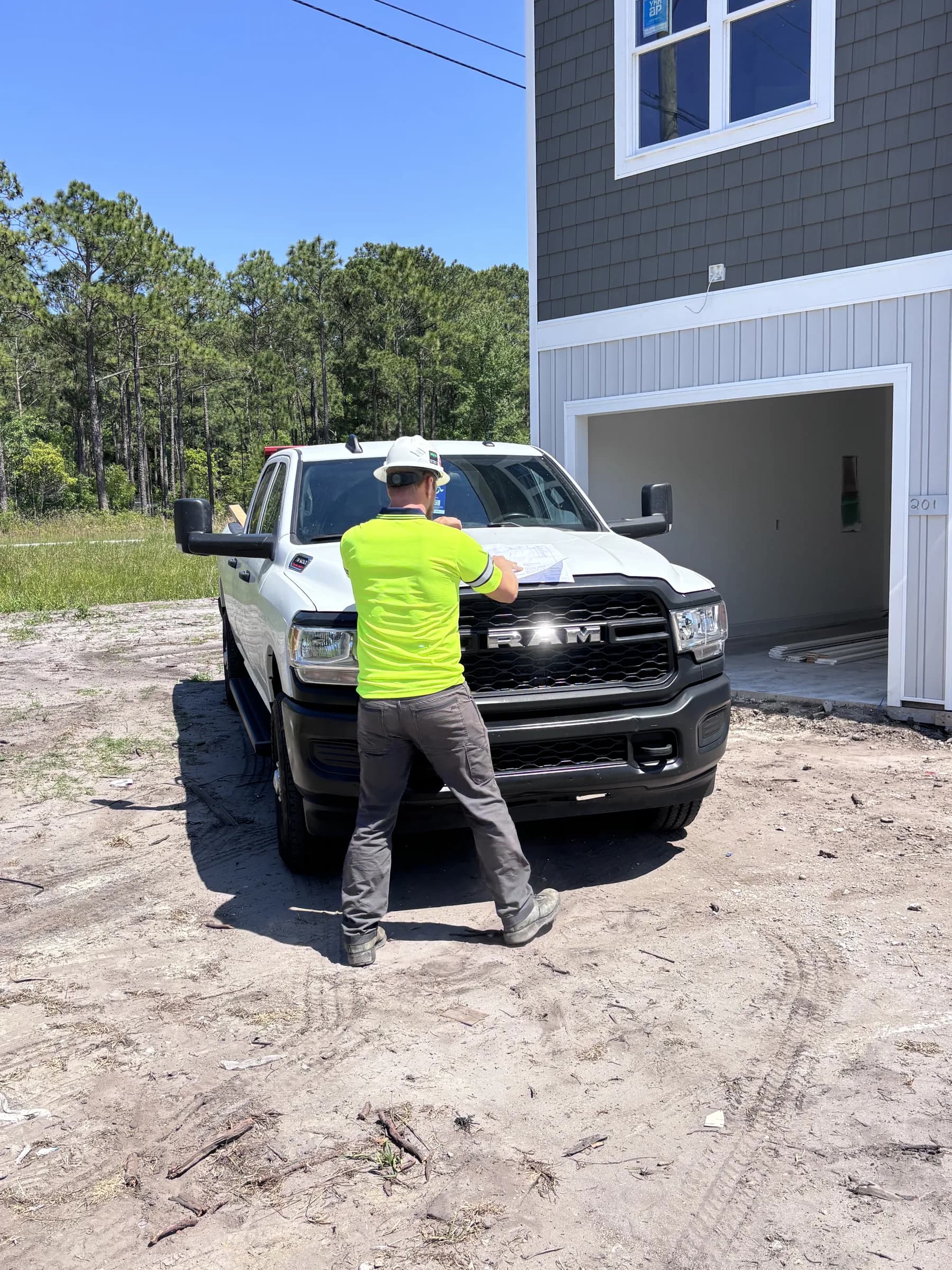 Onslow Construction truck parked in front of a new build under construction in Onslow County, North Carolina